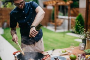 man-cooking-outdoor-kitchen