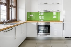 minimalist white and green kitchen
