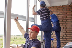 three men installing Marvin windows